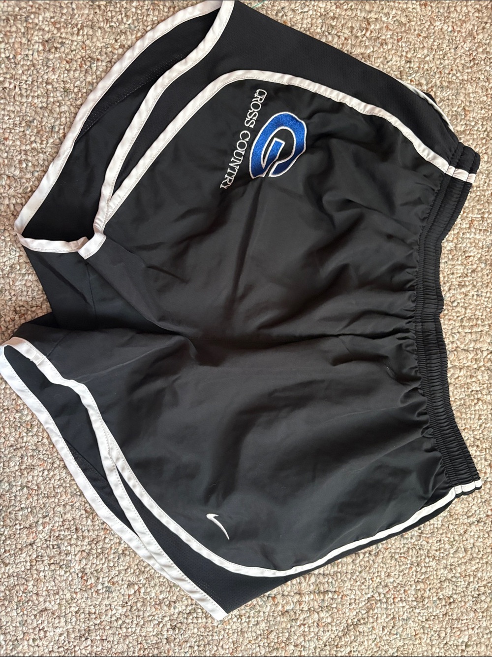 Nike Women’s Black Athletic Shorts with White Trim and Blue Logo
